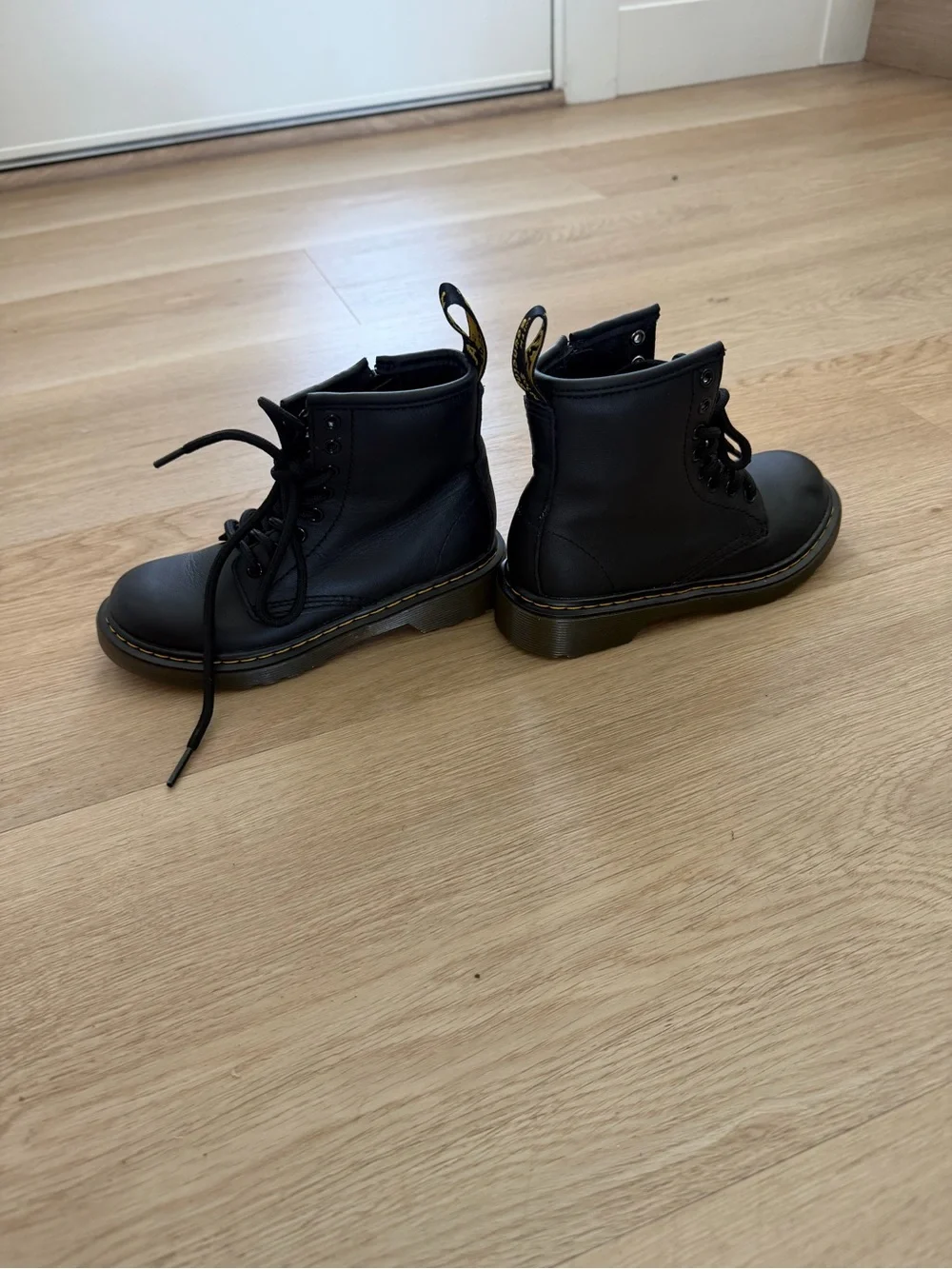 Dr. Martens Kids Black Leather Ankle Boots with Yellow Stitching